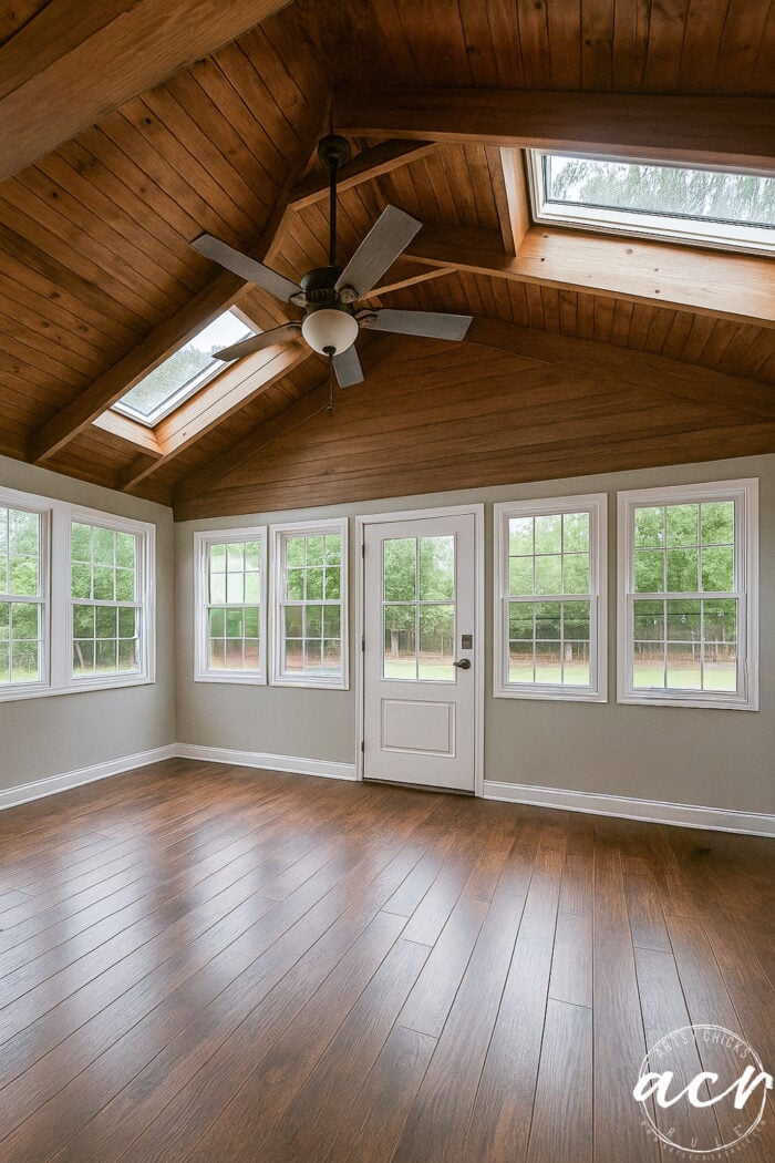 room with stained ceiling and wood floor