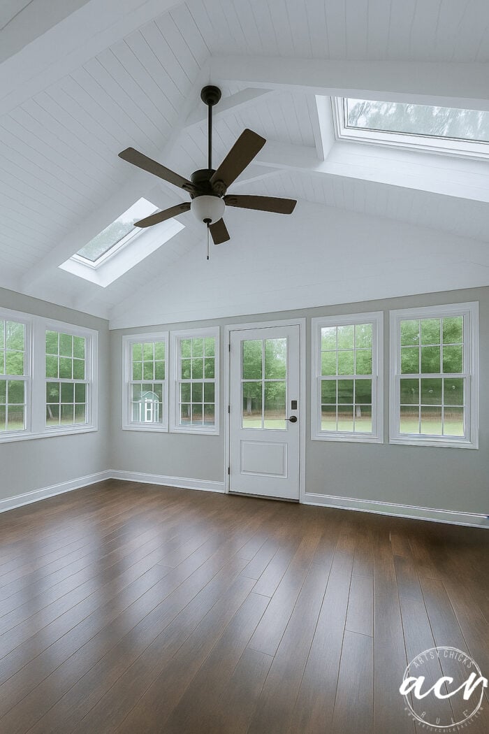 room with white plant ceiling and wood floor
