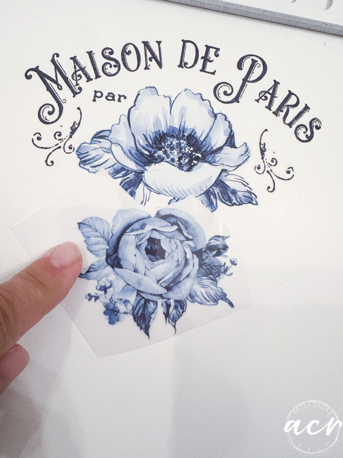 script and blue roses going on another framed art