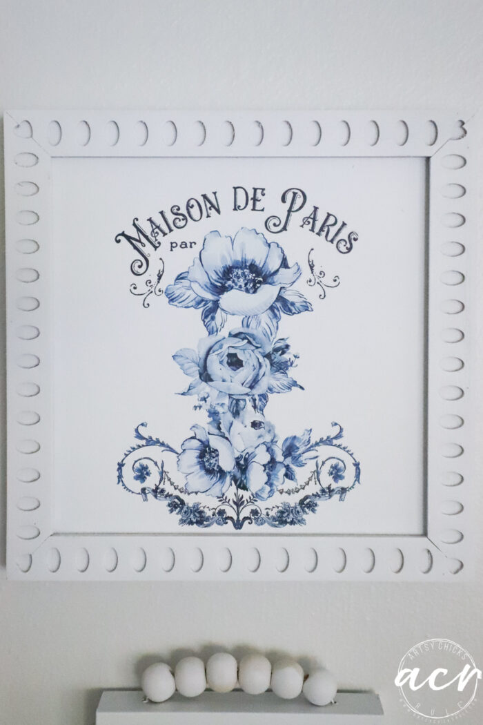 blue and white framed art up close