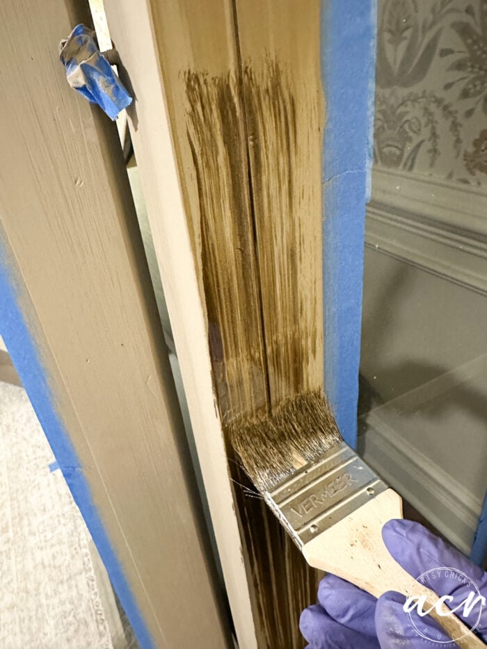 applying stain over paint with chip brush