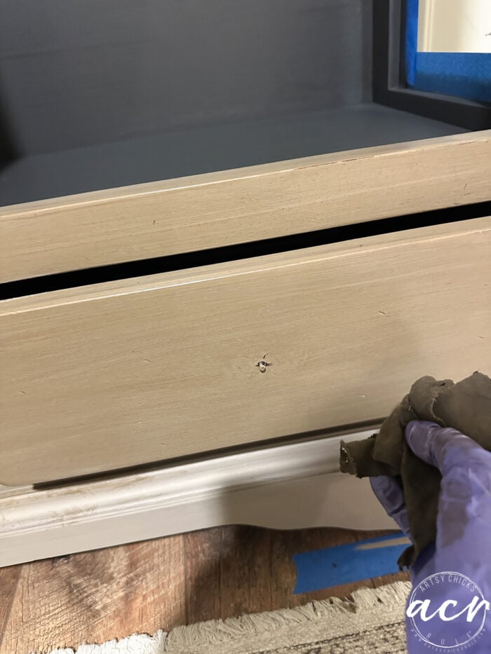 wiping stain in long strokes to mimic wood