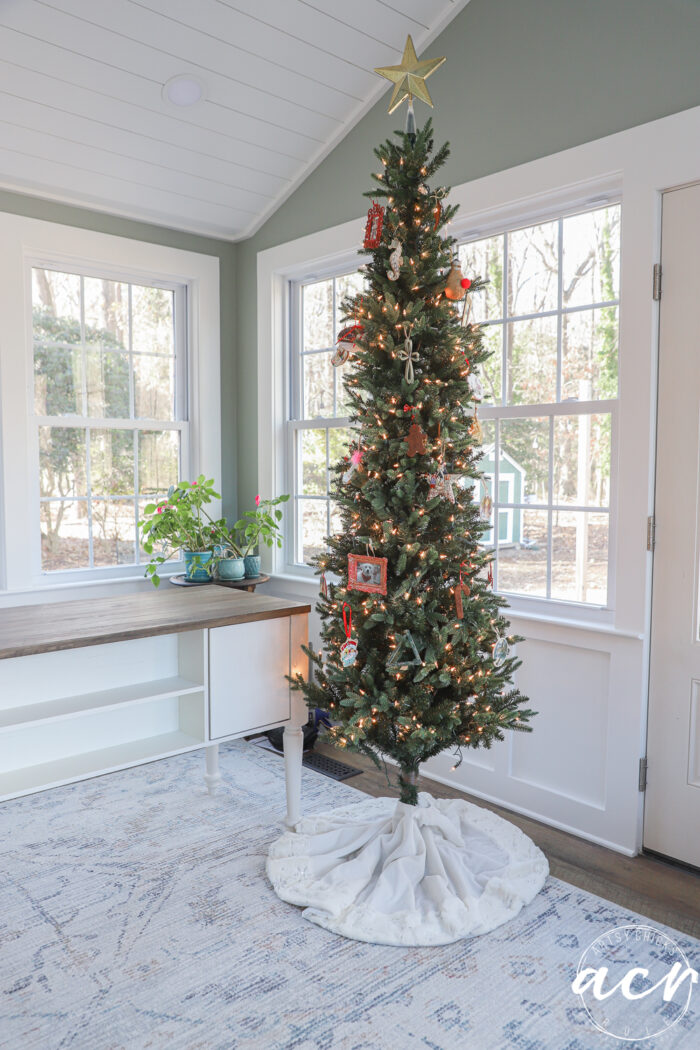 very slim christmas tree with some ornaments