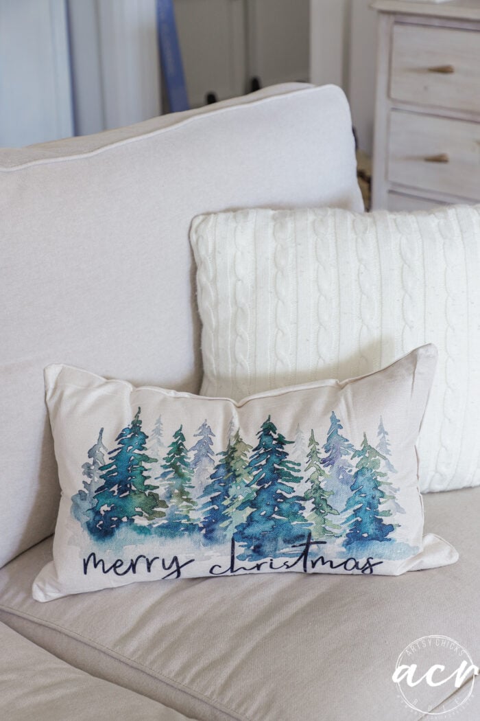 pillow with christmas trees that says merry christmas