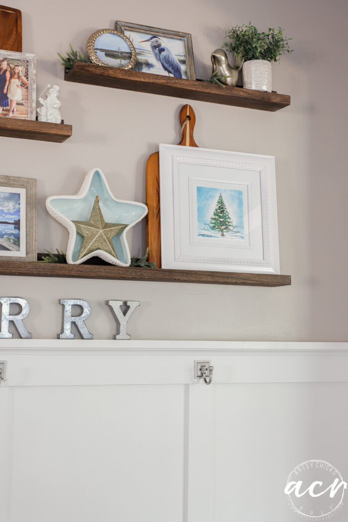 wood wall shelves and framed tree print