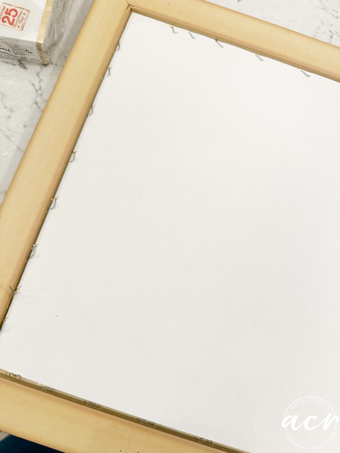 tons of staples on the back of the framed print