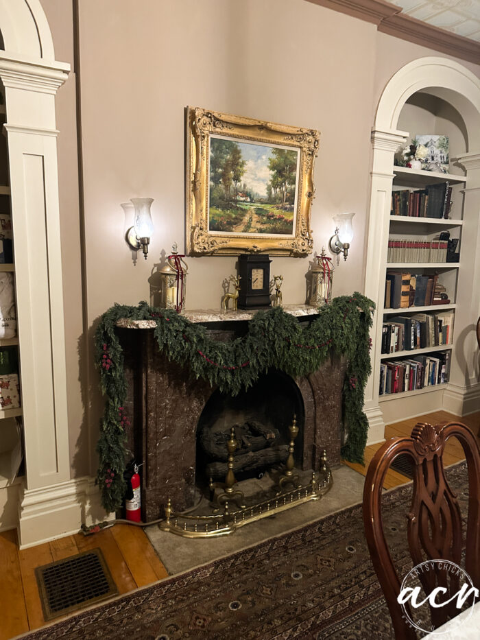 fireplace draped with greenery