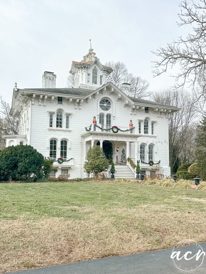 beautiful old white home with christmas decorations