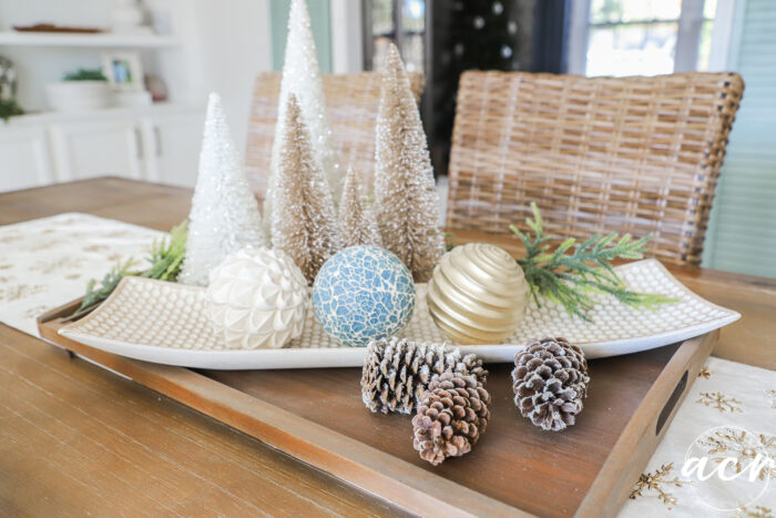 wood tray centerpiece with wire brush christmas trees and pine cones