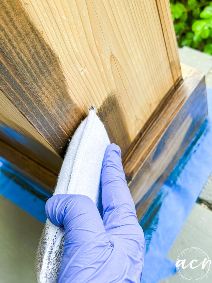 applying stain with applicator