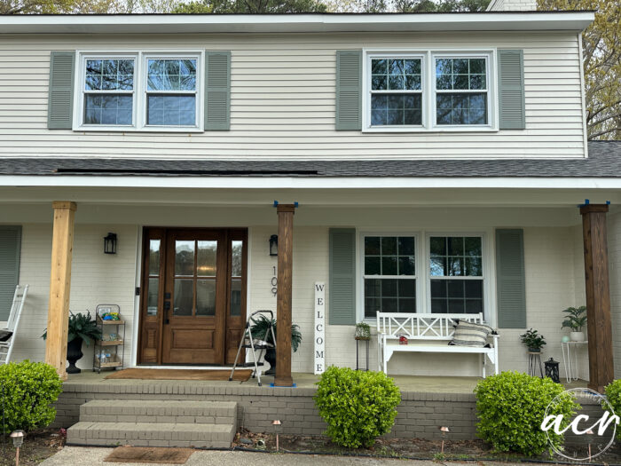 front of house with some stained and some unstained columns
