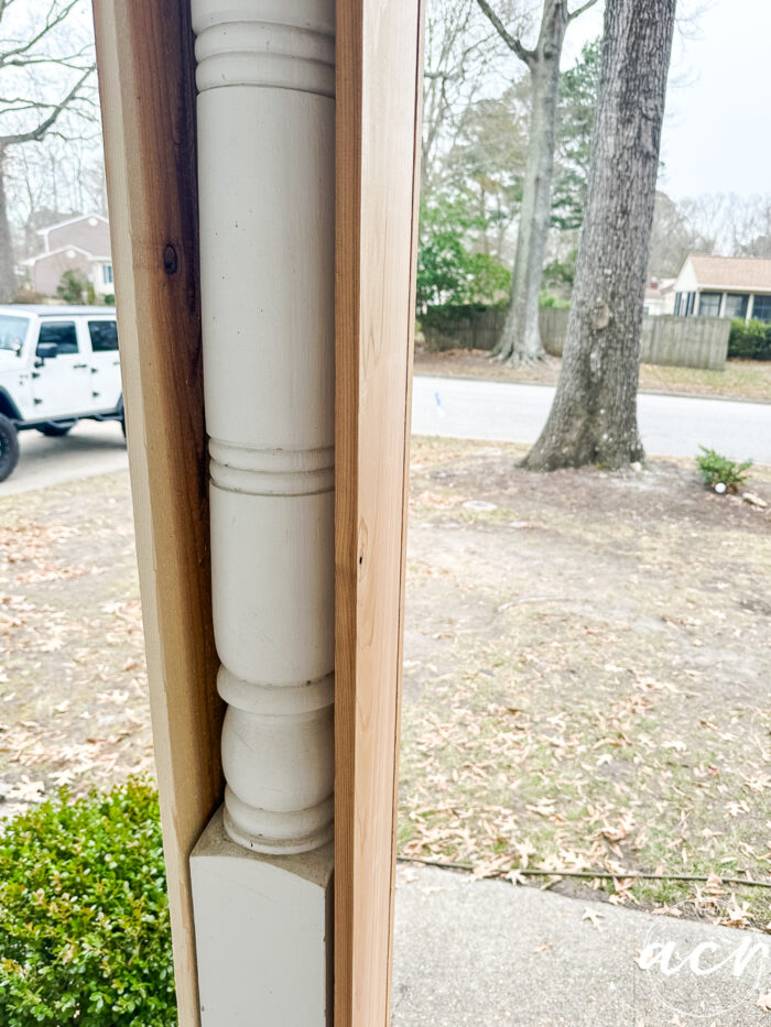 old white turned post wrapped with cedar on 3 sides