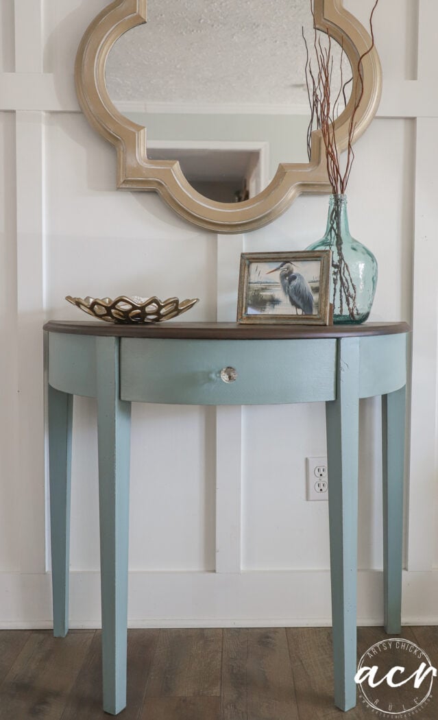 half moon table blue with stained top styled with coastal decor