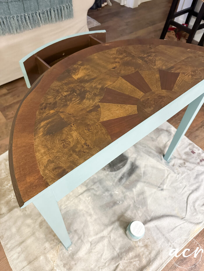 top restained with blue back showing on dropcloth