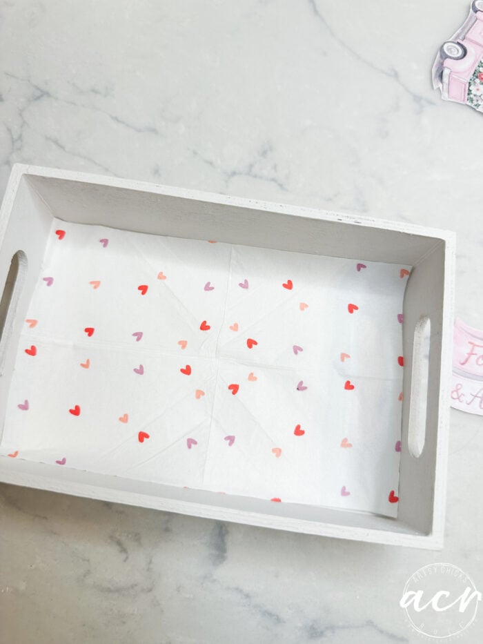 small red and pink hearts on napkin in bottom of white box