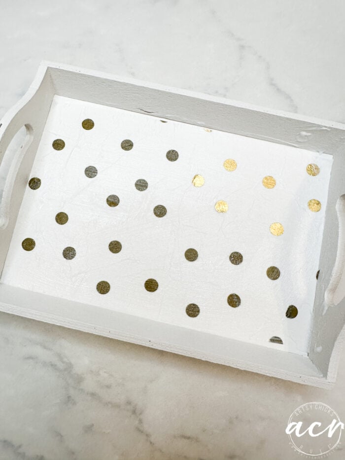 gold polka dots napkin on white tray