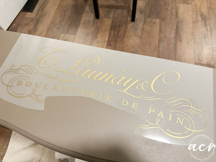 attaching the gold script transfer to top