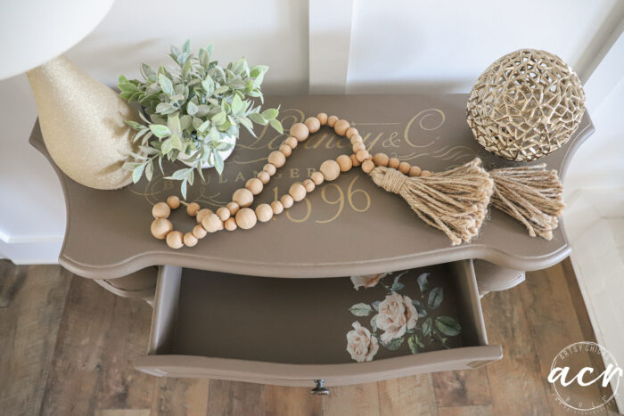 top view table decorated with drawer open to see pink roses inside