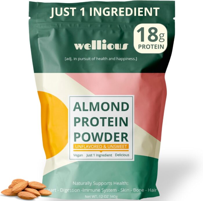 A bag of Wellious Almond Protein Powder featuring colorful geometric designs&mdash;a recent Amazon Find I&rsquo;m loving. The packaging highlights Just 1 Ingredient, 18g protein, and immune support benefits. Some almonds are placed next to the bag.