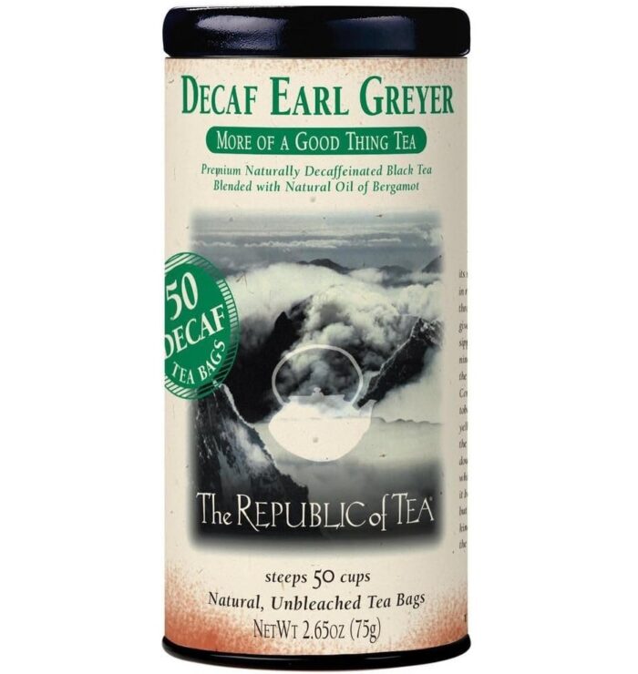 A cylindrical tin of The Republic of Tea Decaf Earl Greyer, an Amazon Find with 50 natural, unbleached tea bags. The label features a misty mountain image and green text highlighting decaf and more of a good thing tea.