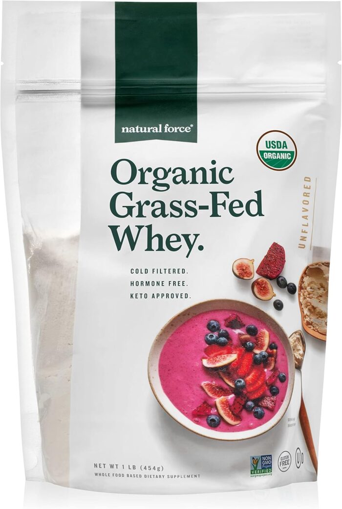 A bag of Natural Force Organic Grass-Fed Whey protein powder&mdash;an Amazon Find labeled USDA Organic, unflavored, cold filtered, hormone free, and keto approved. The package features a pink smoothie bowl with fruit.