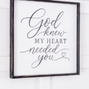 God Knew My Heart Needed You Sign (thrifted redo!) A thrifted redo, this framed God Knew My Heart Needed You sign features elegant script text with a small heart at the end. The dark wood frame adds warmth and charm, making it a meaningful piece of home decor that hangs beautifully on any white wall.