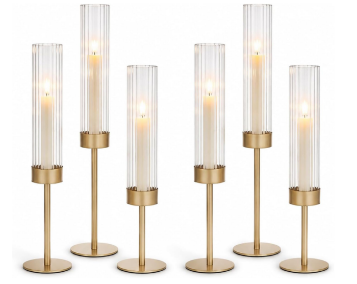 Six tall, gold-toned candle holders from our Christmas favorites, each featuring fluted glass cylindrical shades and a single lit taper candle.