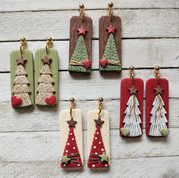 Four pairs of rectangular dangling earrings, each featuring a textured Christmas tree design topped with a star and accented with a small heart, perfect for holiday recommendations.