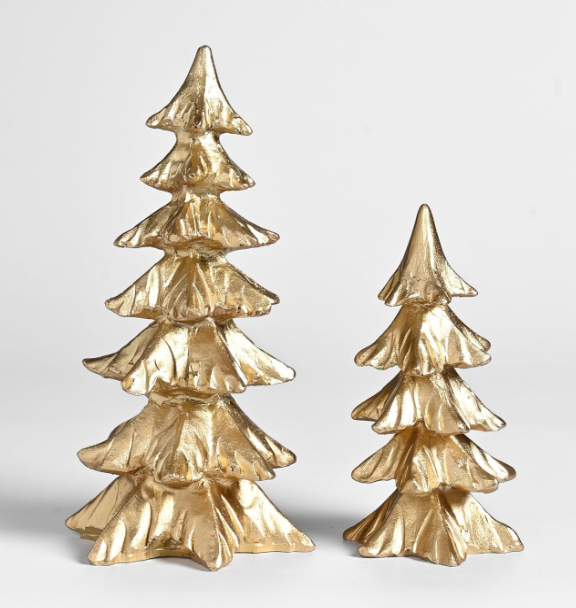 Two gold-colored decorative Christmas trees of different heights, a standout among this season’s holiday trends.